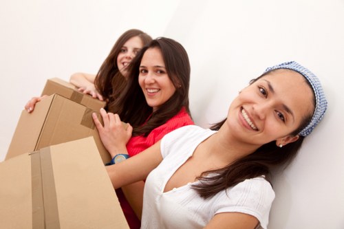 Local moving team navigating a West London street for a house move