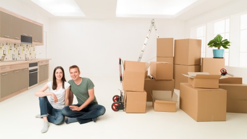 Removal professionals assessing a property for moving risks