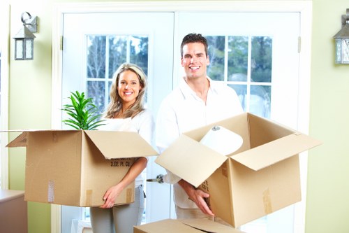 Moving team working in a flat with stairs and lift access in Hammersmith