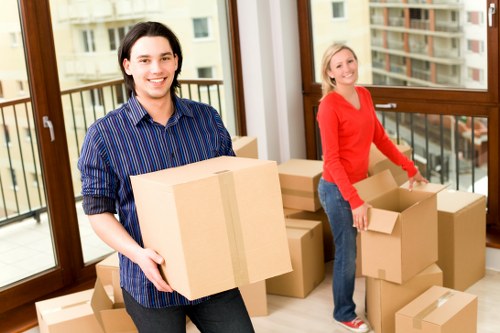 A Hammersmith flat move with boxes, stairway access, and careful furniture handling