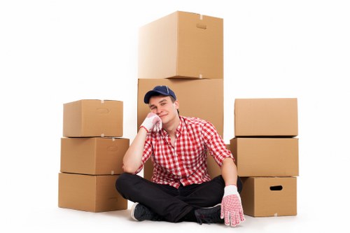 Packed boxes and moving equipment prepared for a Hammersmith relocation